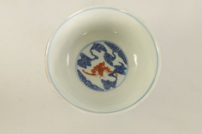 Lot 138 - A CHINESE GUANGXI PERIOD IRON-RED DECORATED BLUE AND WHITE BAT BOWL