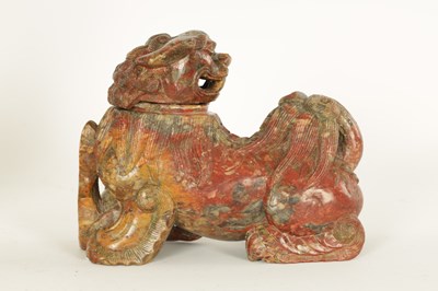 Lot 135 - AN EARLY CHINESE CARVED SOAPSTONE SCULPTURE OF A LIDDED FOO DOG