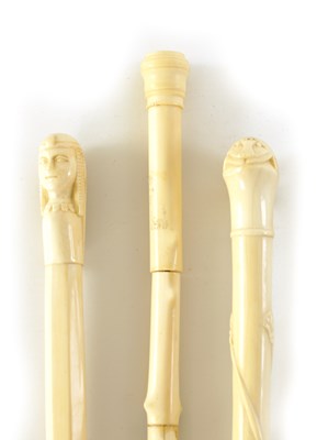 Lot 344 - TWO LATE 19TH CENTURY CARVED IVORY EGYPTIAN-REVIVAL PARASOL HANDLES