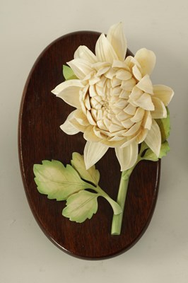 Lot 110 - A GARNITURE OF THREE LATE 19TH CENTURY COLOURED STAINED IVORY FLOWER SPRAY SCULPTURES