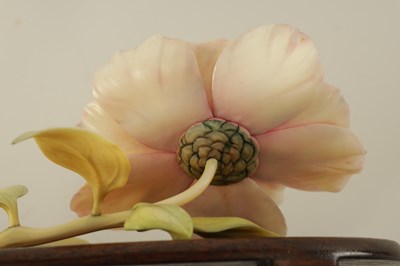 Lot 110 - A GARNITURE OF THREE LATE 19TH CENTURY COLOURED STAINED IVORY FLOWER SPRAY SCULPTURES