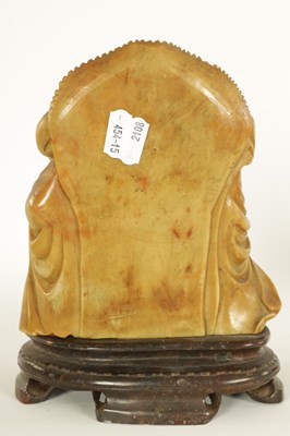 Lot 74 - A CHINESE CARVED SOAPSTONE SCULPTURE