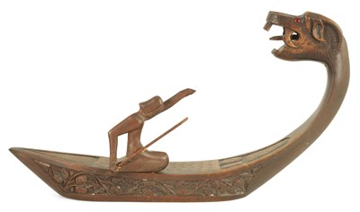 Lot 1333 - A LATE 19TH CENTURY CARVED WOOD SCULPTURE MODELLED AS A FIGURE ON A DRAGON BOAT