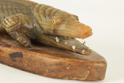 Lot 111 - A LATE 19TH CENTURY CARVED HORN CROCODILE SCULPTURE