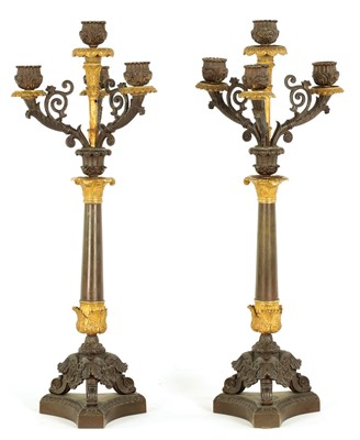 Lot 481 - A PAIR OF REGENCY BRONZE AND ORMOLU THREE BRANCH CANDELABRA