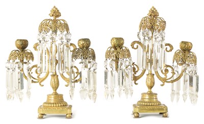 Lot 470 - A PAIR OF 19TH CENTURY BRASS AND CUT GLASS CANDELABRA