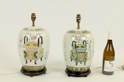 Lot 164 - A PAIR OF 18TH/19TH CENTURY CHINESE FAMILLE ROSE LIDDED GINGER JARS
