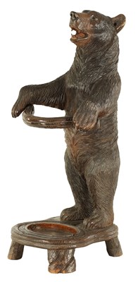 Lot 599 - A LATE 19TH CENTURY CARVED BLACK FOREST BEAR STICK STAND