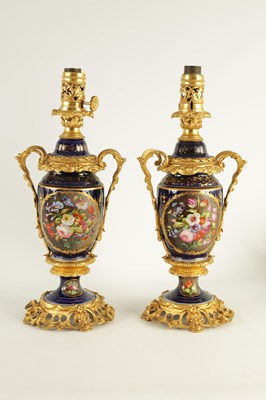 Lot 68 - A PAIR OF 19TH CENTURY CONTINENTAL ORMOLU MOUNTED PORCELAIN LAMP BASES