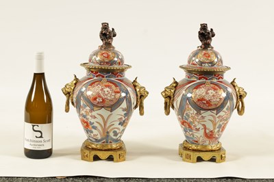 Lot 101 - A PAIR OF 18TH CENTURY JAPANESE IMARI VASES AND COVERS WITH ORMOLU MOUNTS