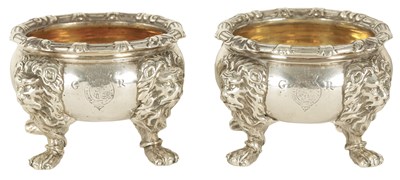 Lot 313 - A RARE PAIR OF GEORGE II CAST SILVER SALT CELLARS BEARING THE ROYAL CYPHER AND CREST OF GEORGE II  IN THE MANNER OF PAUL DE LAMERIE