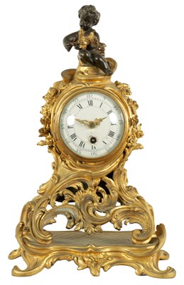 Lot 662 - A LATE 19TH CENTURY FRENCH ROCOCO STYLE ORMOLU MANTEL CLOCK