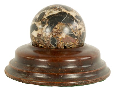 Lot 546 - A 19TH CENTURY MARBLE BALL ON TURNED TREENWARE MAHOGANY STAND