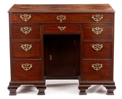 Lot 819 - A GEORGE III MAHOGANY KNEEHOLE DESK with...