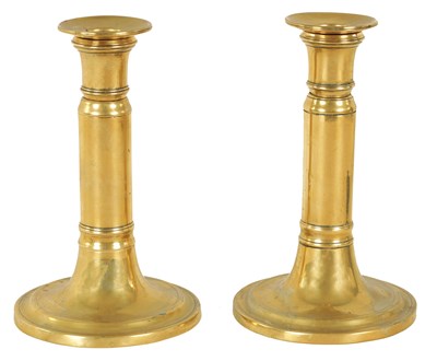 Lot 404 - A PAIR OF GEORGIAN TELESCOPIC BRASS CANDLESTICKS