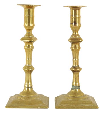 Lot 405 - A PAIR OF EARLY GEORGE III CAST BRASS CANDLESTICKS