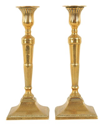 Lot 406 - AN ELEGANT PAIR OF GEORGE III CAST BELL METAL CANDLESTICKS