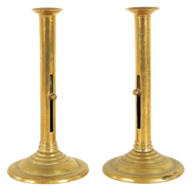 Lot 409 - A PAIR OF GEORGE III CAST BRASS CANDLESTICKS