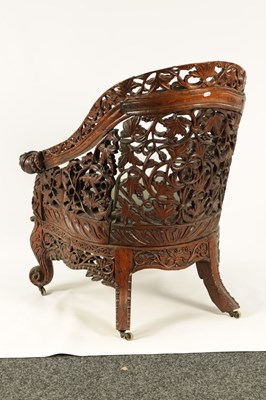 Lot 208 - A 19TH CENTURY ANGLO INDIAN CARVED HARDWOOD LIBRARY CHAIR