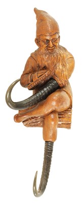 Lot 593 - AN EARLY 20TH CENTURY BLACK FOREST CARVED LINDENWOOD COAT HOOK