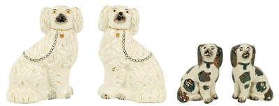 Lot 1136 - A PAIR OF LATE 19TH CENTURY STAFFORDSHIRE SEATED SPANIEL DOGS