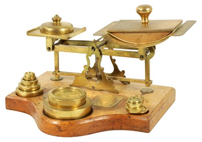 Lot 1291 - A SET OF LATE 19TH CENTURY BRASS PARCEL SCALES AND WEIGHTS