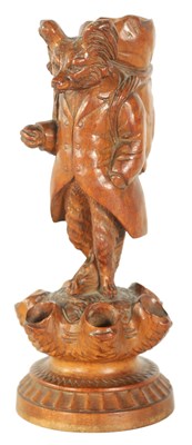 Lot 590 - A 19TH CENTURY BLACK FOREST CARVED CIGAR STAND MODELLED AS A FOX