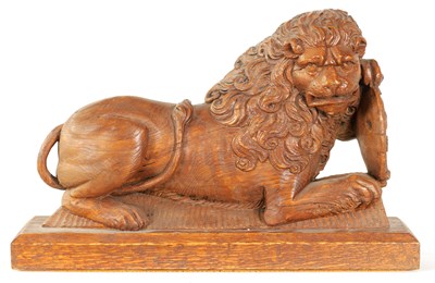 Lot 558 - AN 18TH CENTURY CARVED OAK LION