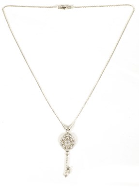 Lot 246 - AN 18CT WHITE GOLD DIAMOND ENCRUSTED KEY PENDANT AND CHAIN NECKLACE
