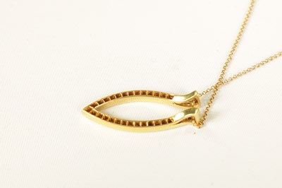 Lot 247 - A LADIES 9CT YELLOW GOLD DIAMOND PENDANT AND CHAIN