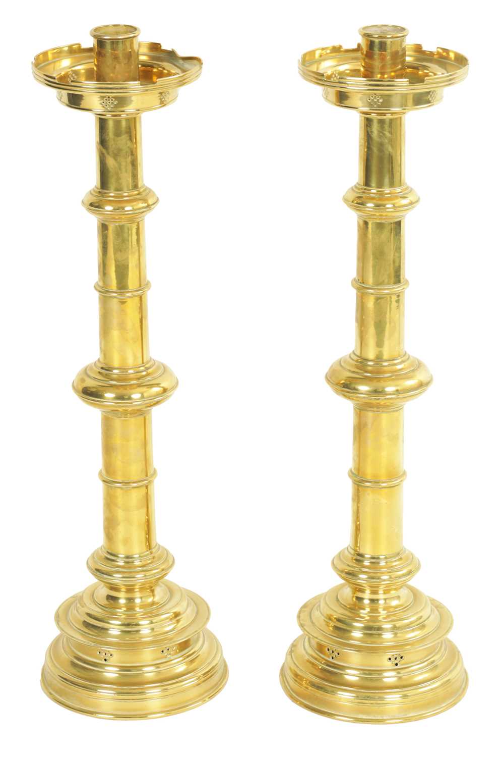 Lot 10 - A PAIR OF LATE 19TH CENTURY BRASS OVERSIZED GOTHIC STYLE CANDLESTICKS