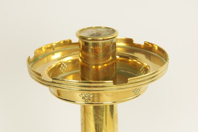 Lot 10 - A PAIR OF LATE 19TH CENTURY BRASS OVERSIZED GOTHIC STYLE CANDLESTICKS