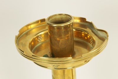 Lot 10 - A PAIR OF LATE 19TH CENTURY BRASS OVERSIZED GOTHIC STYLE CANDLESTICKS