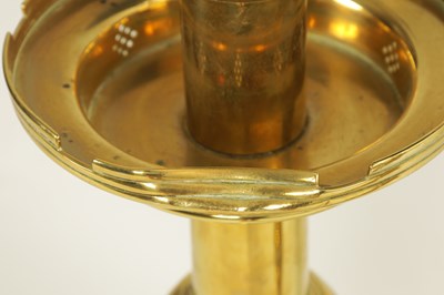Lot 10 - A PAIR OF LATE 19TH CENTURY BRASS OVERSIZED GOTHIC STYLE CANDLESTICKS