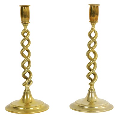 Lot 1118 - A PAIR OF 19TH CENTURY BARLEY TWIST BRASS CANDLESTICKS