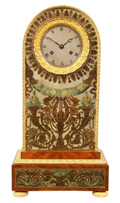 Lot 702 - AN UNUSUAL FRENCH EMPIRE FIGURED MAHOGANY AND ORMOLU MANTEL CLOCK