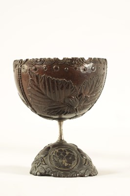 Lot 548 - AN 18TH CENTURY CARVED COCONUT SHELL ON STAND