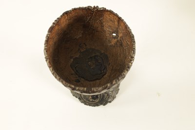 Lot 548 - AN 18TH CENTURY CARVED COCONUT SHELL ON STAND