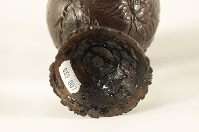 Lot 548 - AN 18TH CENTURY CARVED COCONUT SHELL ON STAND