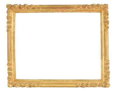 Lot 1050 - AN 18TH CENTURY LEAF CARVED GILT FRAME