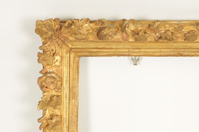 Lot 1050 - AN 18TH CENTURY LEAF CARVED GILT FRAME