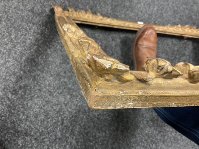 Lot 1050 - AN 18TH CENTURY LEAF CARVED GILT FRAME