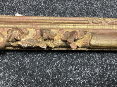 Lot 1050 - AN 18TH CENTURY LEAF CARVED GILT FRAME