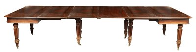 Lot 957 - A REGENCY FIGURED MAHOGANY EXTENDING DINING TABLE IN THE MANNER OF GILLOWS