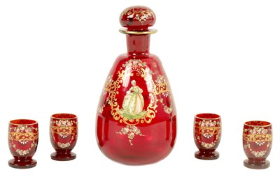 Lot 1143 - A 19TH CENTURY BOHEMIAN RUBY GLASS LIQUOR SET