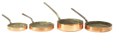 Lot 1376 - A SET OF FOUR 19TH-CENTURY GRADUATED COPPER FRYING PAN LIDS