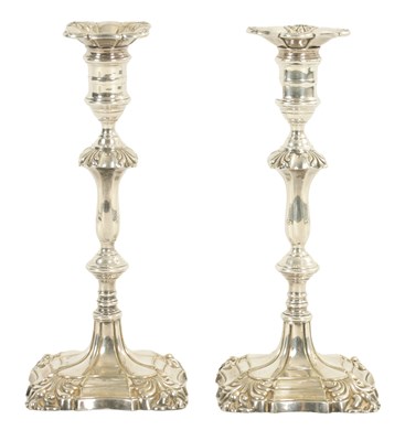 Lot 297 - A PAIR OF 19TH CENTURY GEORGE I STYLE SILVER PLATED CANDLESTICKS