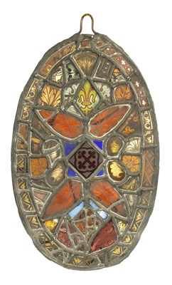 Lot 464 - AN 18TH CENTURY STAINED GLASS PANEL WITH FRAGMENTS OF GLASS FROM EARLIER WINDOWS