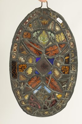 Lot 464 - AN 18TH CENTURY STAINED GLASS PANEL WITH FRAGMENTS OF GLASS FROM EARLIER WINDOWS