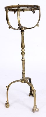 Lot 285 - AN 18TH CENTURY CAST BRASS COMPANION STAND OF...
